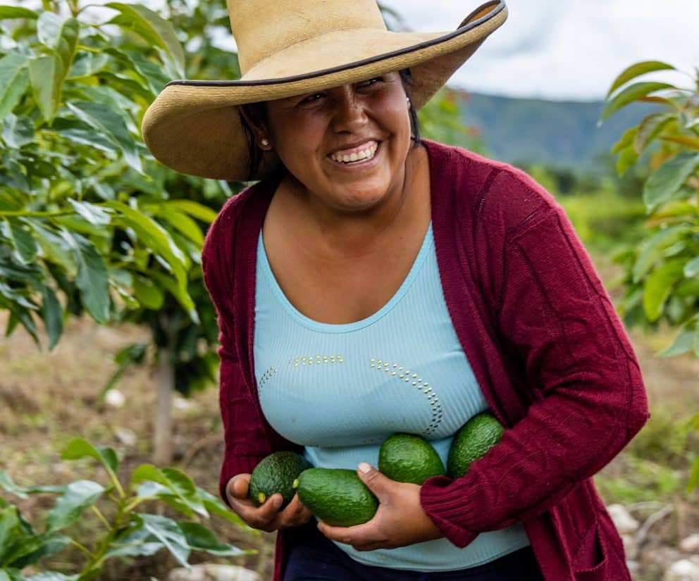 Female Avocado Farmer Smiling in Field