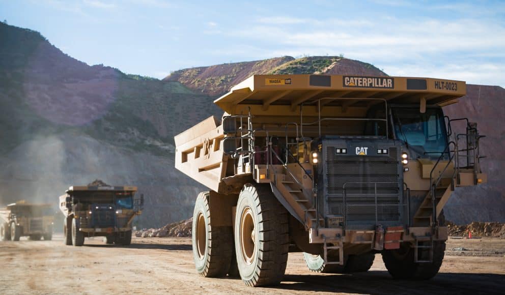Three Mining Trucks on Site at Mining Operation